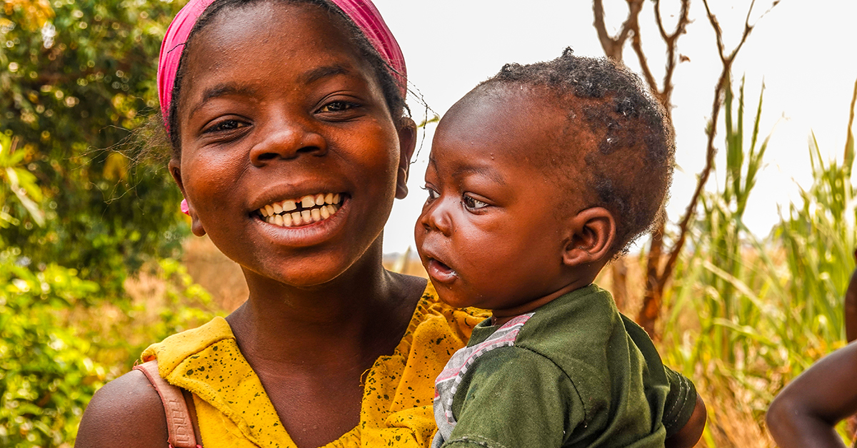 Smiling woman with young son, zambia, Johan Leach, clean safe water