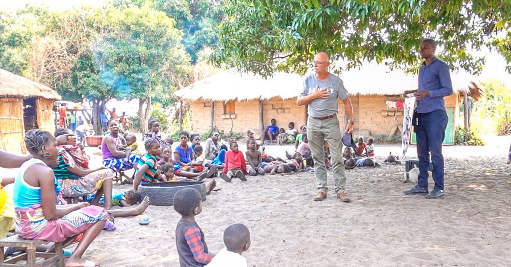 Johan Leach preaches the Gospel as villagers listen. Leach, Zambia, Clean Safe Water