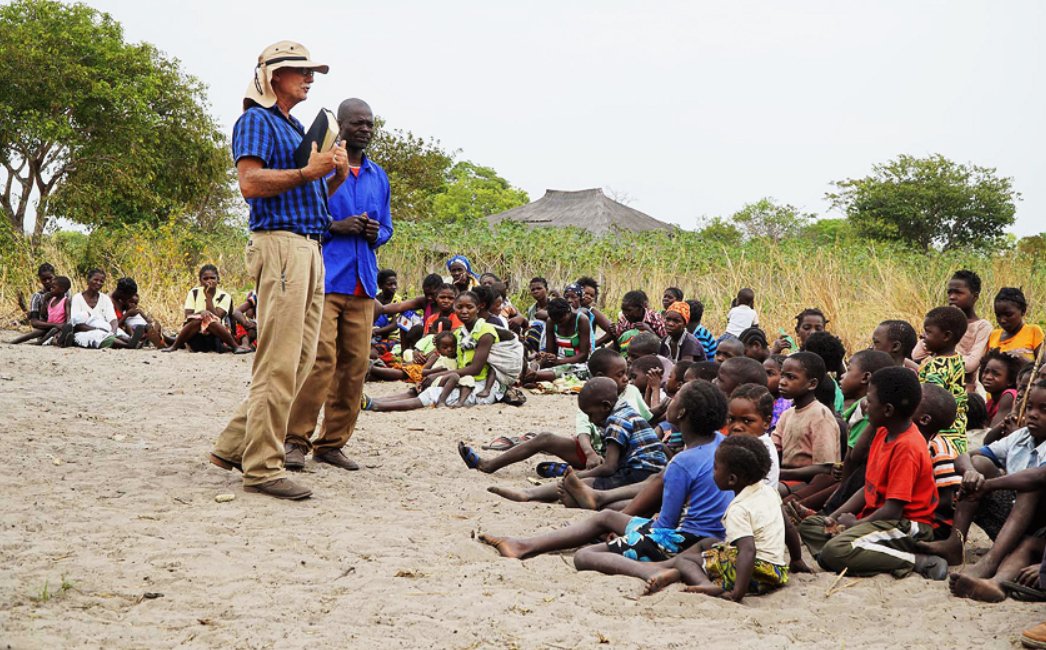 Johan Leach preaching at a borehole outreach, Angola
